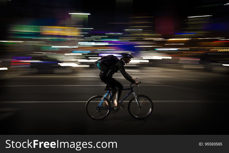 Photo Lapse Photo of Man Riding a Road Bicycle
