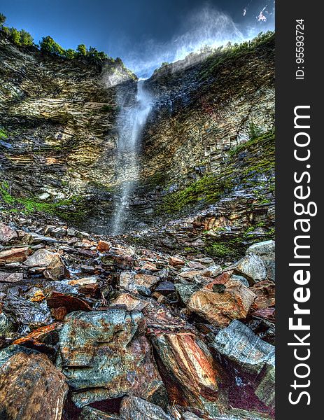 Waterfall On Rocky Cliff