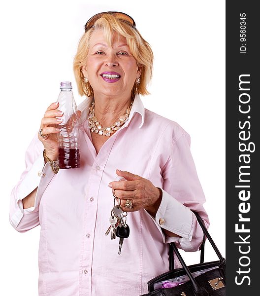 Senior Woman with bottle of juice (isolated on white). Senior Woman with bottle of juice (isolated on white)