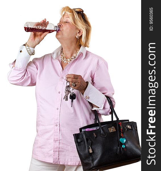Senior Woman with bottle of juice (isolated on white). Senior Woman with bottle of juice (isolated on white)