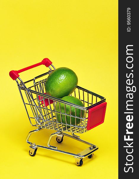 Limes in a shopping cart.