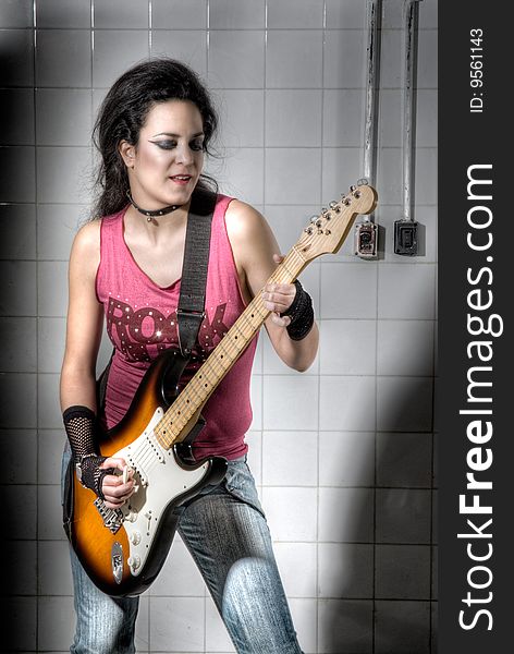 Female playing electric guitar