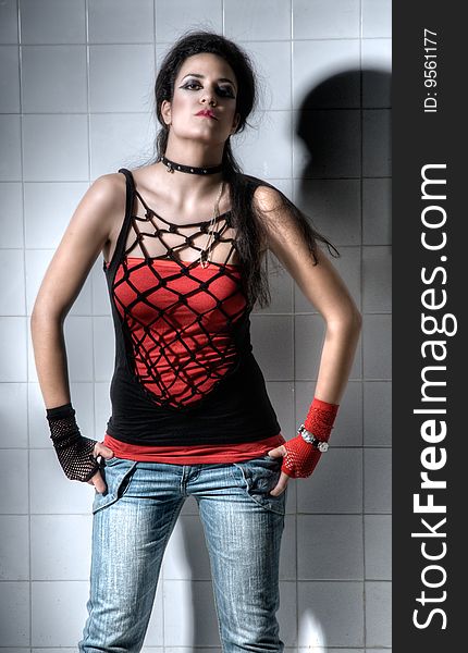 Punk Girl posing hardly on an underground background. Punk Girl posing hardly on an underground background