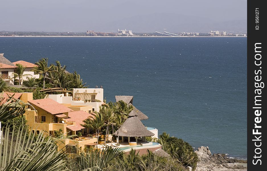 Villas on the Mexican Pacific coast with Bay of Banderas background. North of Puerto Vallarta