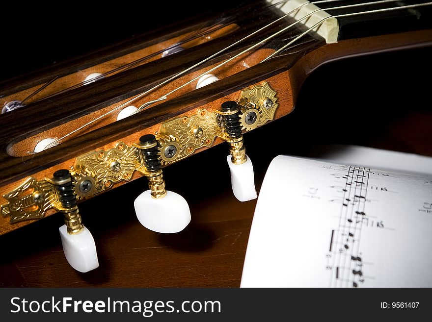 Closeup image of gold plated classical guitar tuners