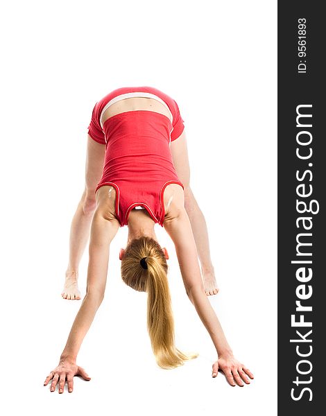 A pretty young blond girl in red underwear doing her gymnastic exercises. A pretty young blond girl in red underwear doing her gymnastic exercises