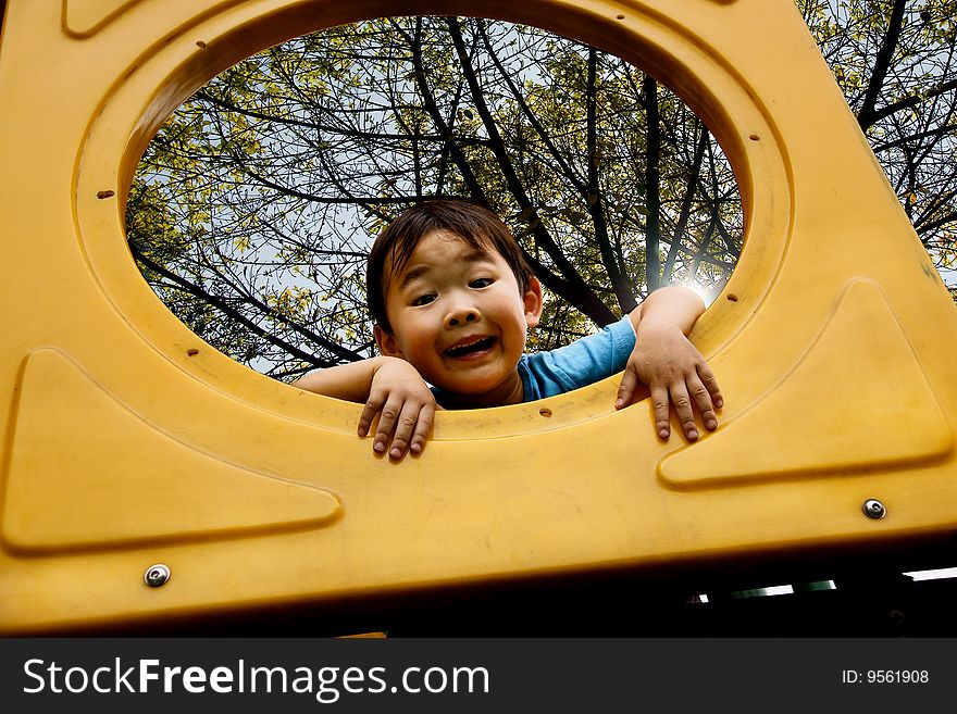 Boy Playing In Amusement Park