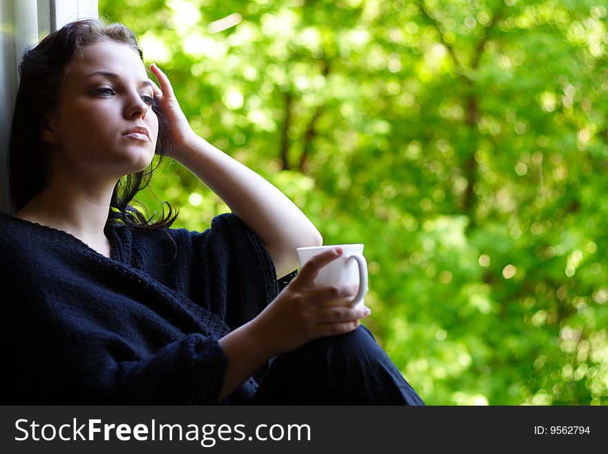 Lovely girl with a mug of coffee