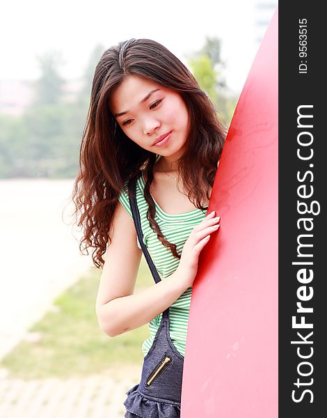 A modern asian girl outdoors. A modern asian girl outdoors