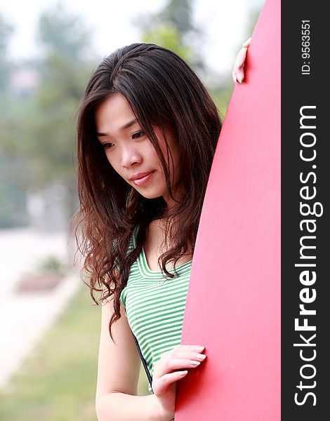 A modern asian girl outdoors. A modern asian girl outdoors.