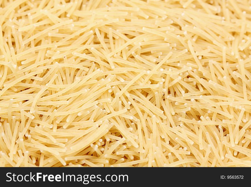 A macro shot of a heap of vermicelli pasta. A macro shot of a heap of vermicelli pasta.