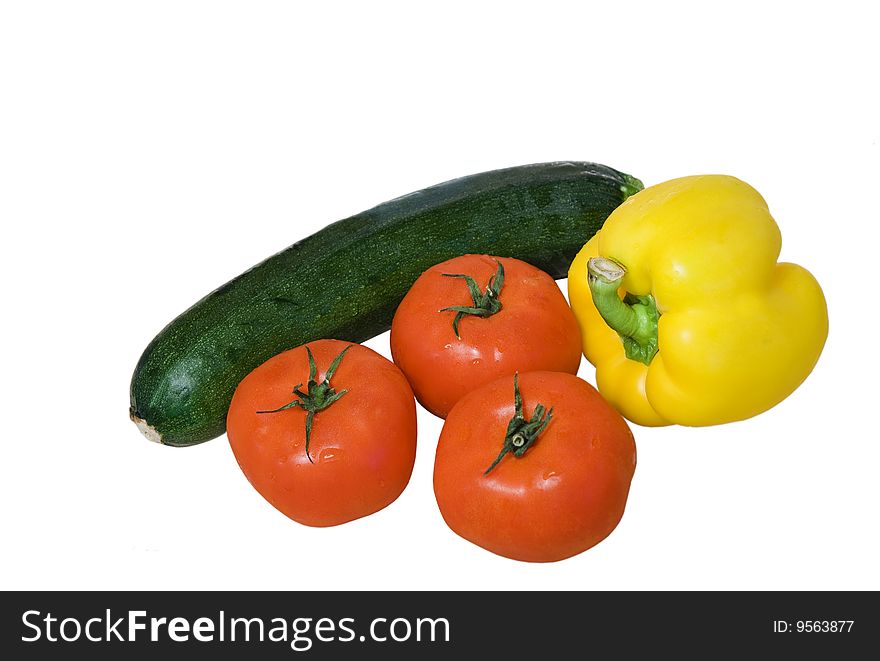 Courgette, yellow pepper and tomatoes isolated on white. Courgette, yellow pepper and tomatoes isolated on white