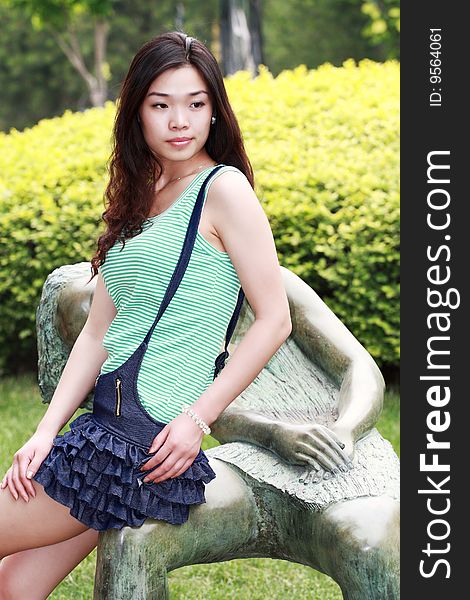 A modern asian girl outdoors. A modern asian girl outdoors.
