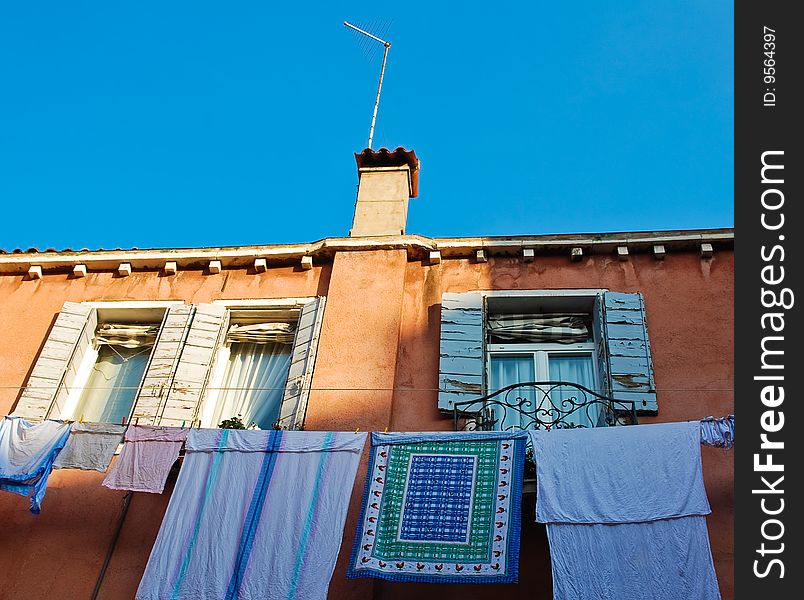 Wall of an old Venice building with drying laundry. Wall of an old Venice building with drying laundry