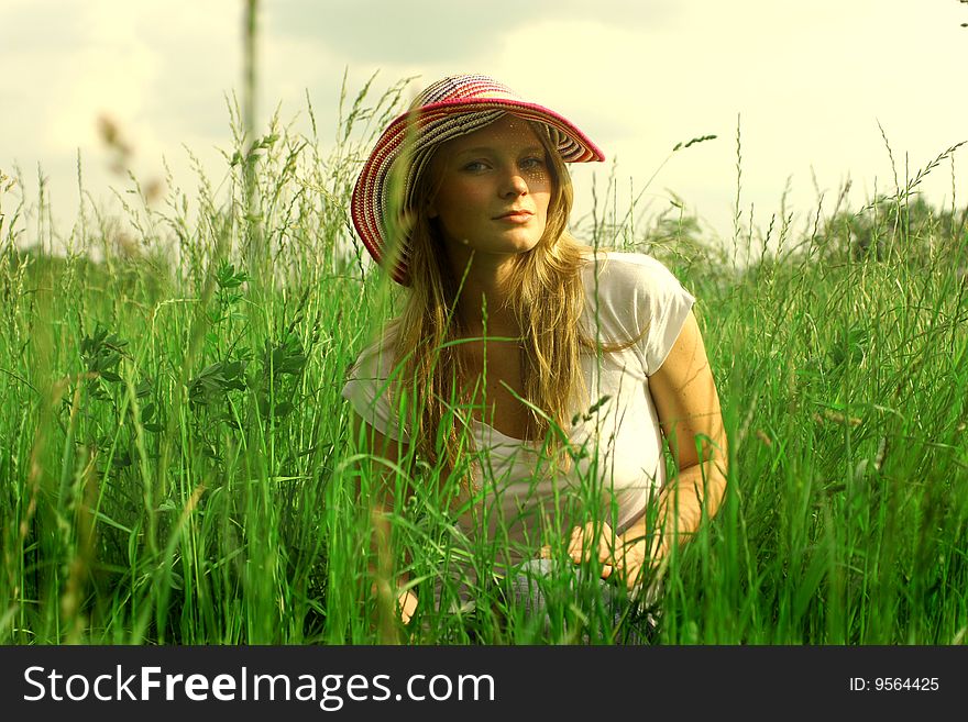 Young woman in grass field