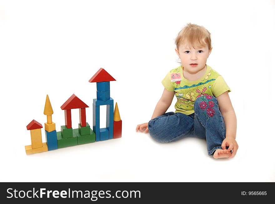 Little girl playing with cubes