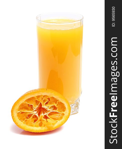 Orange and juice in glass isolated on white background