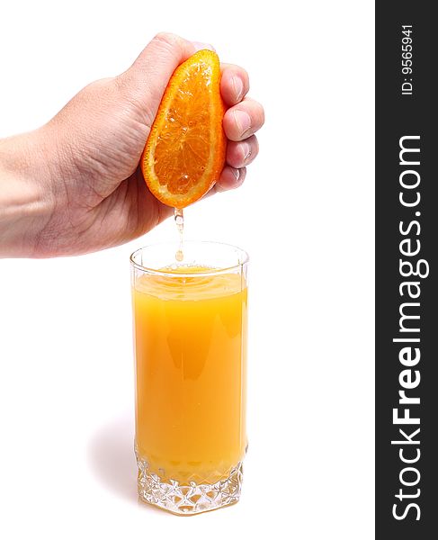 Hand orange and juice in glass isolated on white background