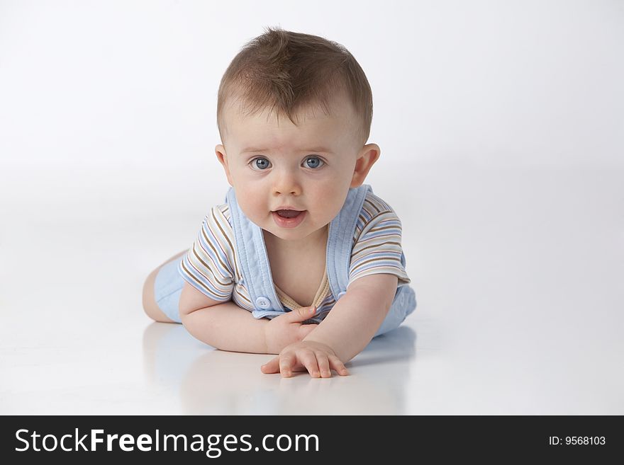 Little boy with blue eyes on a white background. Little boy with blue eyes on a white background