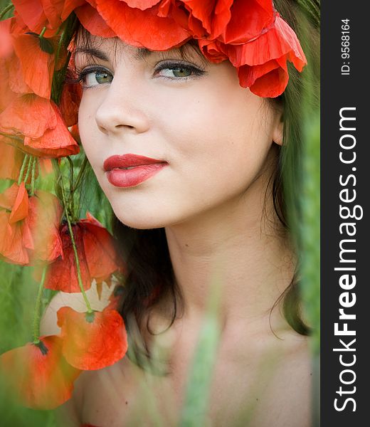 Portrait of beautiful girl in poppies crown. Portrait of beautiful girl in poppies crown