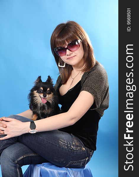 The Girl With The Doggie On A Blue Background