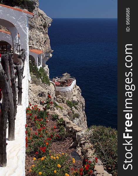 Perspective to the terraces on a cliff above the Mediterranean sea in Balearics