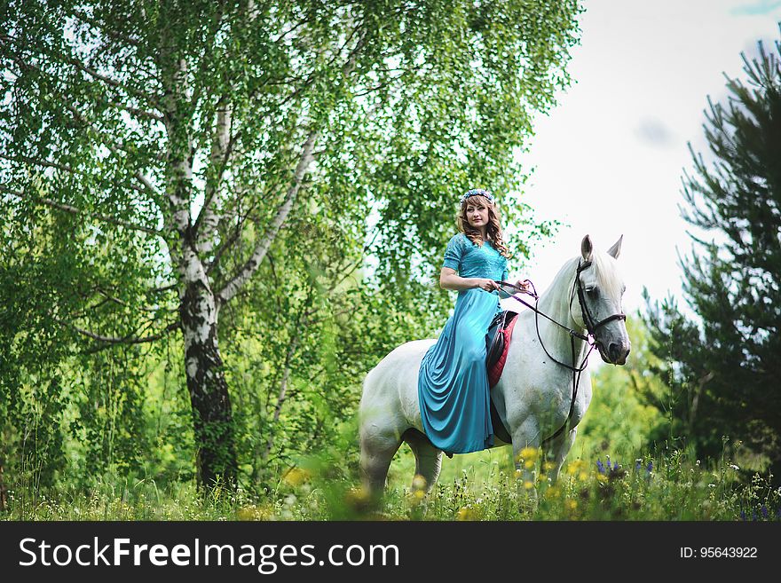 Woman in White Horse Inside Forest