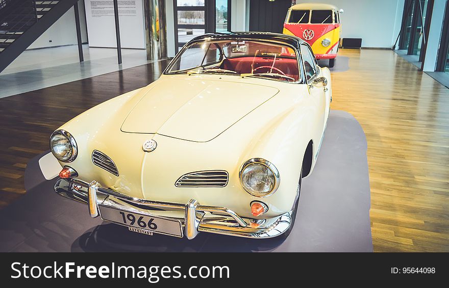 A classic Volkswagen automobile in a museum.