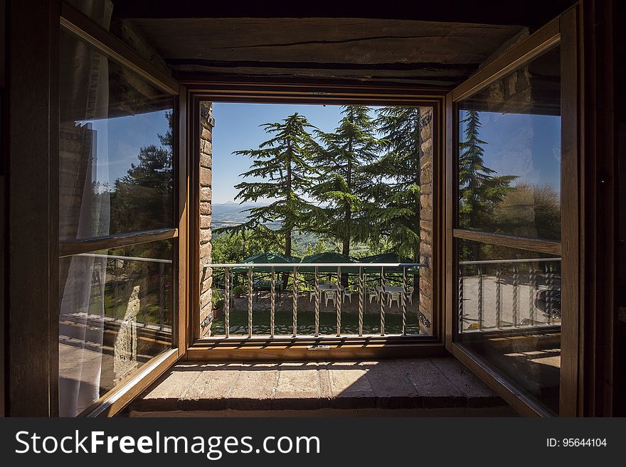 Window on large garden with trees