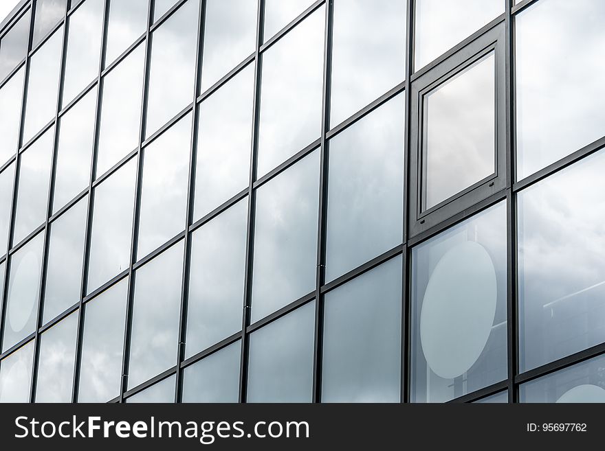 The exterior wall of a building with glass panels. The exterior wall of a building with glass panels.