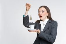 The Woman In A Business Suit Holds A Cup Royalty Free Stock Images
