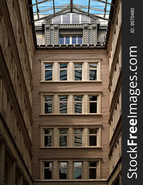 Passage, glass roof over old building yard