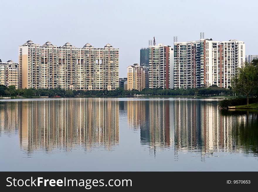 Chinese peaceful community with some modern buildings beside the lake. Chinese peaceful community with some modern buildings beside the lake