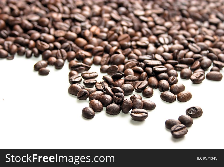 Coffee bean close up isolated against white background. Coffee bean close up isolated against white background.