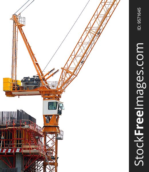 Side view of a tower crane at a construction site. Side view of a tower crane at a construction site