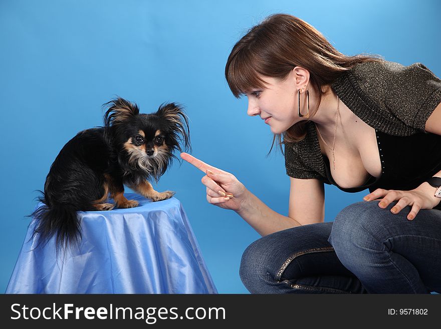 The Girl With The Doggie On A Blue Background