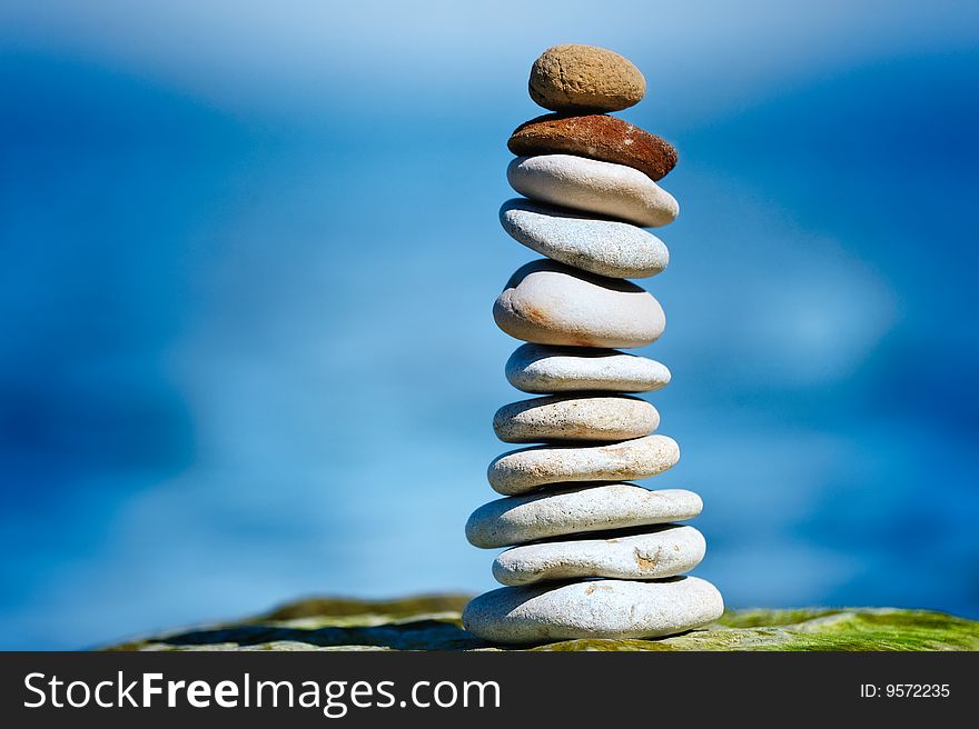 Two red pebbles on top of white pile. Two red pebbles on top of white pile