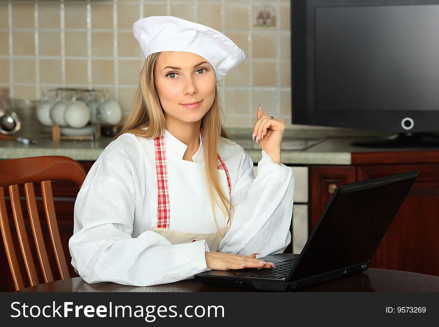 A cook is cooking on a kitchen. A cook is cooking on a kitchen.