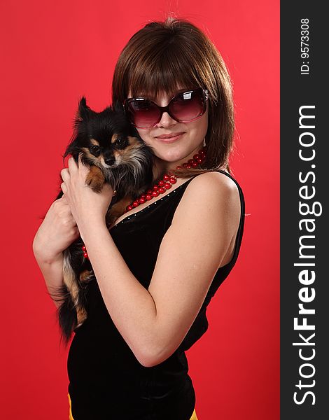 The young girl on a red background. The young girl on a red background