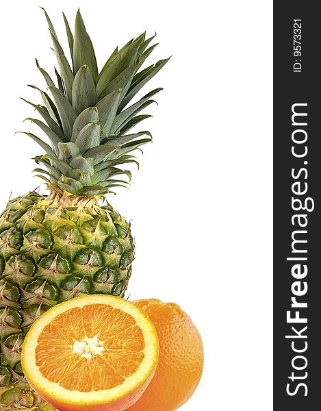 Juicy oranges and pineapple isolated over white. Juicy oranges and pineapple isolated over white.