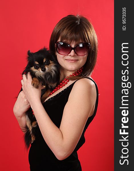 The young girl on a red background. The young girl on a red background