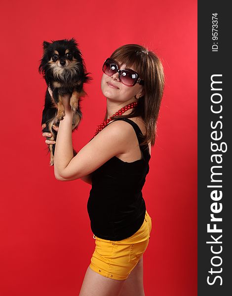 The young girl on a red background. The young girl on a red background