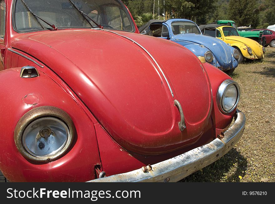 Abandon red old car at field