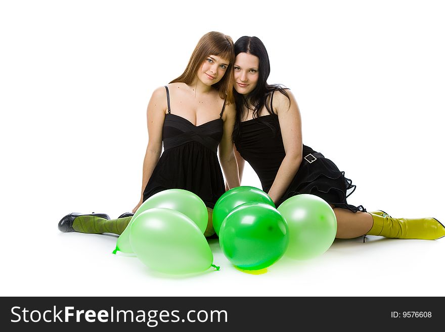 Two young girls with green balloons. Isolated on white background. Two young girls with green balloons. Isolated on white background