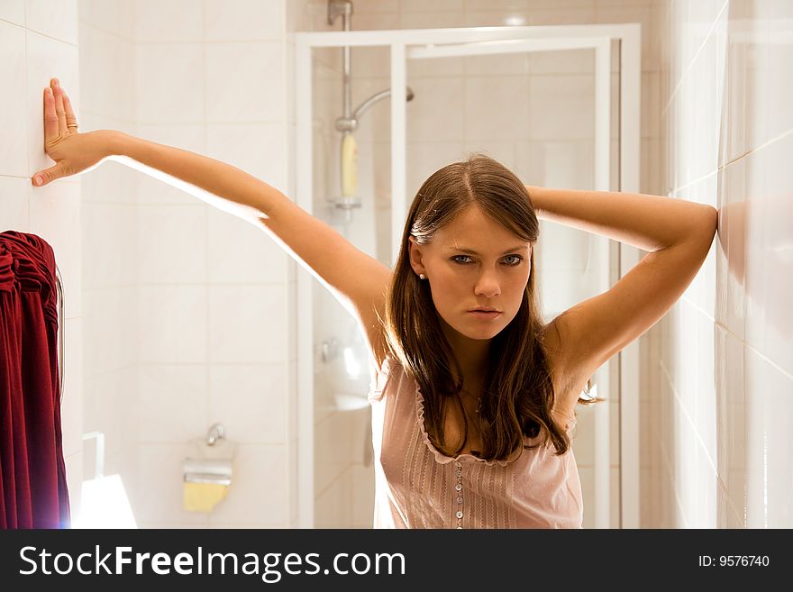 Young brunette woman in bathroom. Young brunette woman in bathroom