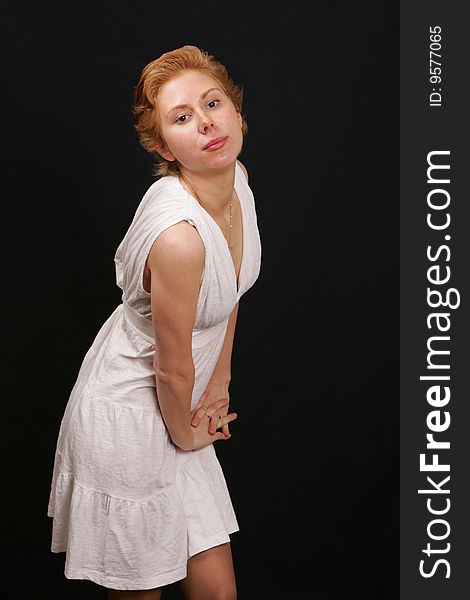 Red-haired woman in white dress