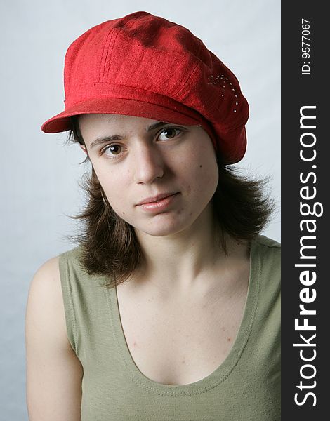 Portrait of a young girl in red cap