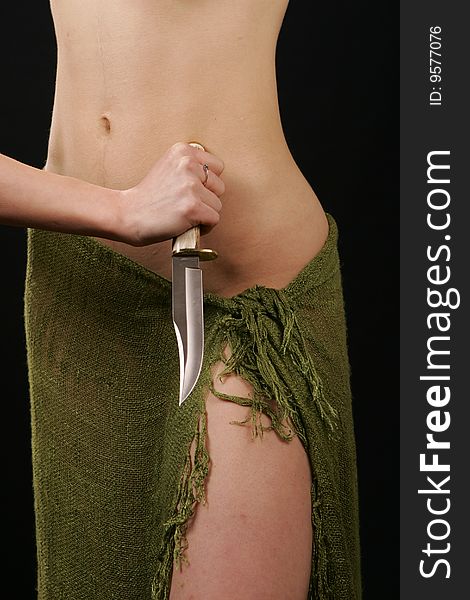 Female body and knife in hand. Female body and knife in hand