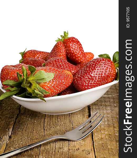 Fresh strawberries on a white plate with white background. Fresh strawberries on a white plate with white background