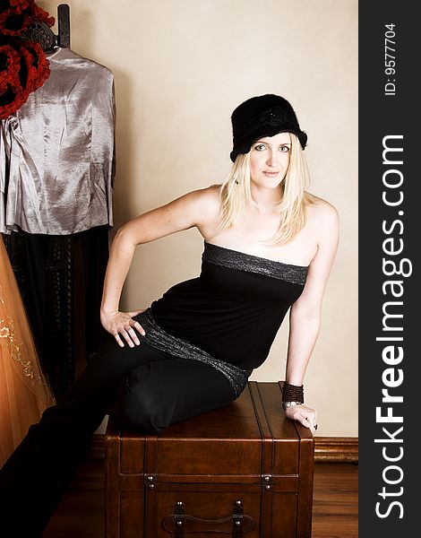 Beautiful young blond model wearing a black hat. Beautiful young blond model wearing a black hat